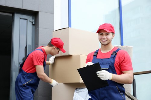 Loading furniture and boxes into a van for a Penge move