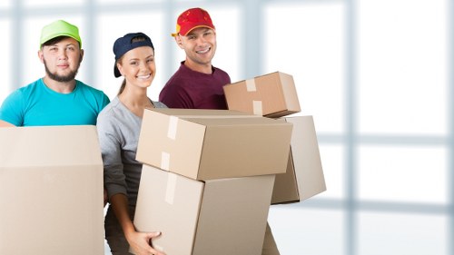 Packed boxes and furniture ready for collection in a Penge home
