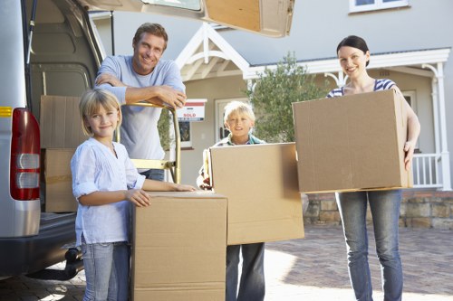 Professional Man With Van Penge team handling furniture and packed items