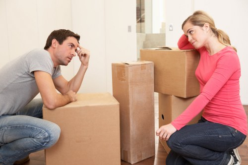 Commercial movers loading office furniture in a local street