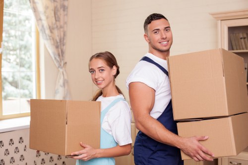 Team communicating during careful furniture handling