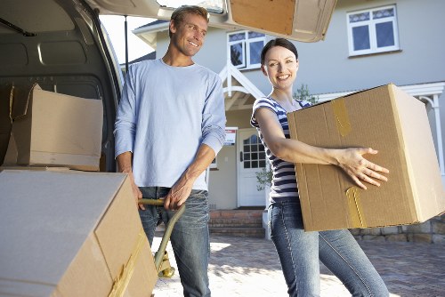Loading furniture into a van during a local move in Penge