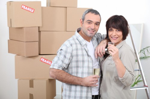 House removalists delivering boxes into a Penge home